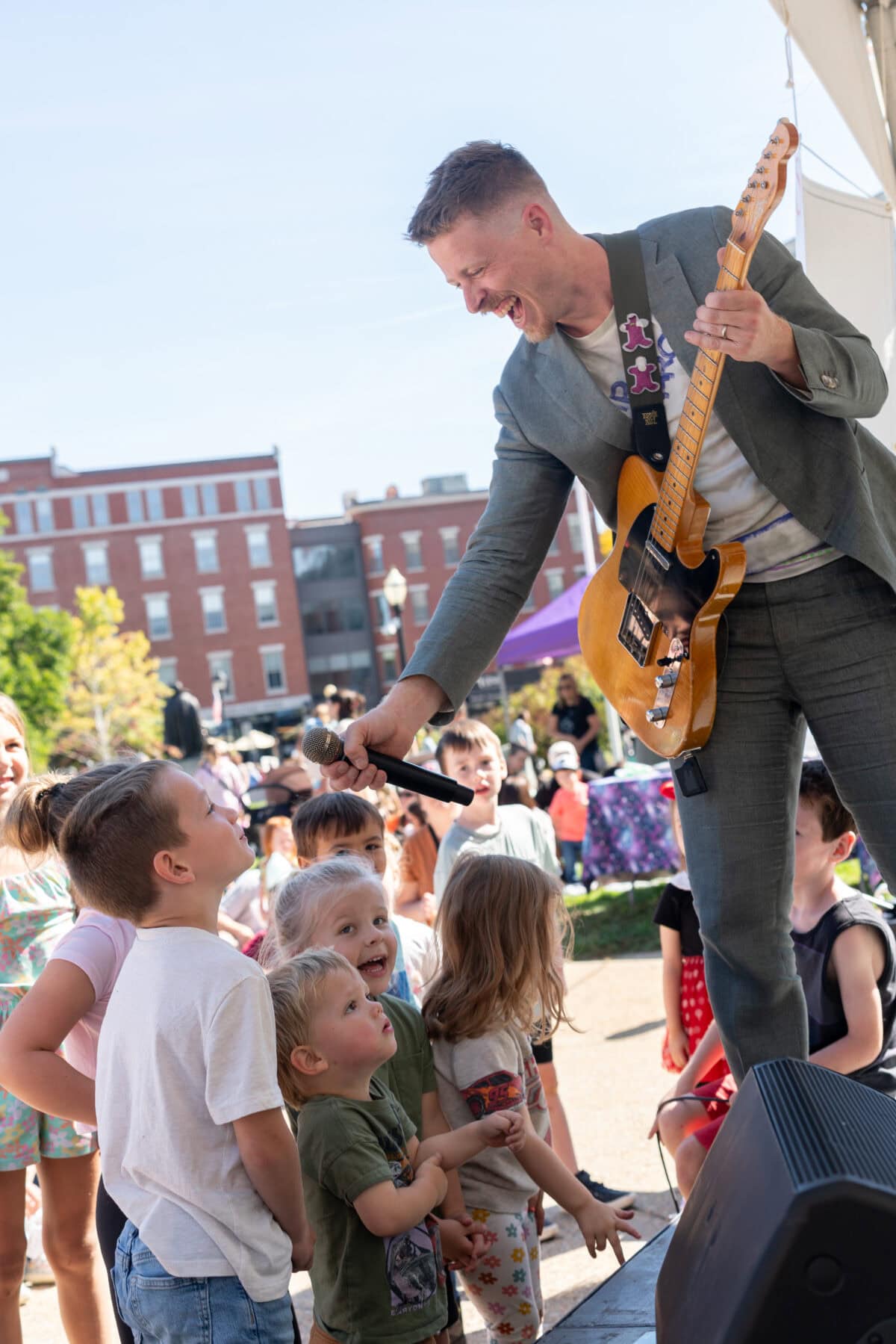 Mr Aaron performing with kids